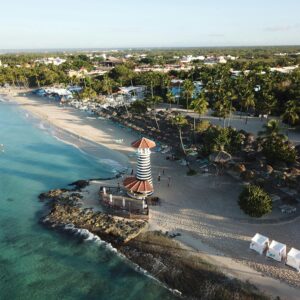 A stunning aerial view of Dominicus Beach with its iconic lighthouse in the Dominican Republic.